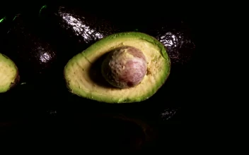 Stock Video Avocado Sliced In Half On A Dark Background For PC