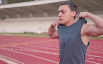 Stock Video Athletic Man Takes Off His Shirt After Exercise For PC