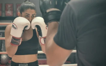 Stock Video Athletic Female Doing Kickboxing Training In A Boxing Ring For PC