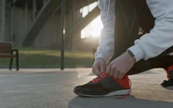 Stock Video Athlete Tying Shoelaces Before Training For PC