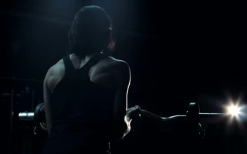 Stock Video Athlete Lifting The Barbell In A Dark Room For PC
