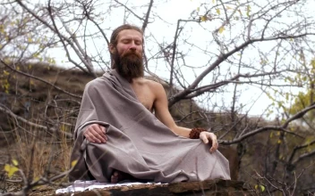 Stock Video Ascetic Yogi Sitting In Nature Meditating For PC