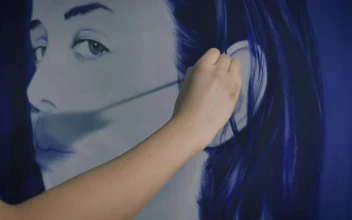 Stock Video Artist Working On A Very Large Portrait For PC