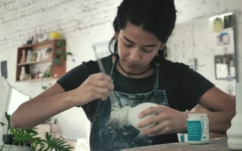 Stock Video Artist Varnishing A Vase For PC