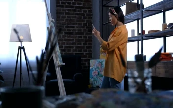 Stock Video Artist Taking A Photo Of Her Work For PC