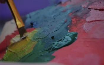 Stock Video Artist Mixing Paint On A Palette For PC