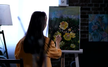 Stock Video Artist Adding The Final Details To Her Painting For PC