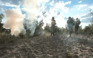 Stock Video Armed Soldiers Walking On The Field For PC