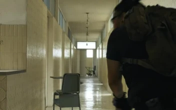 Stock Video Armed Man Securing An Area In An Empty Building For PC