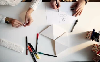 Stock Video Architects Planning At A Desk With Blueprints For PC