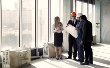 Stock Video Architects Discussing Building Plan For PC