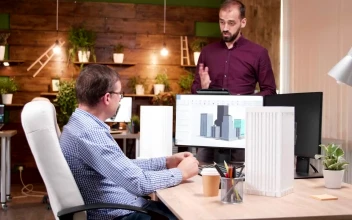 Stock Video Architects Discussing Building Designs For PC