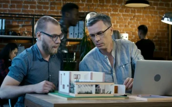 Stock Video Architects Checking A House Model At The Office For PC