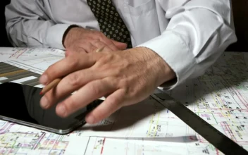 Stock Video Architect Using A Phone Calculator For PC