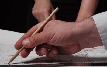 Stock Video Architect Drawing On Plans For PC