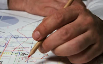 Stock Video Architect Drawing On Building Plans For PC