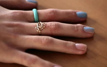 Stock Video Applying Blue Nail Polish To A Woman Hand For PC