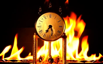 Stock Video Antique Clock Burning On Black Background For PC