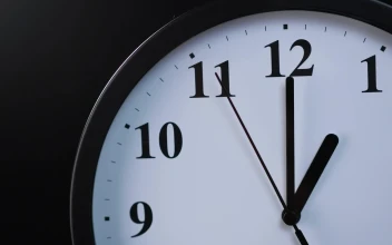 Stock Video Analog Wall Clock On A Black Background In A Closed For PC