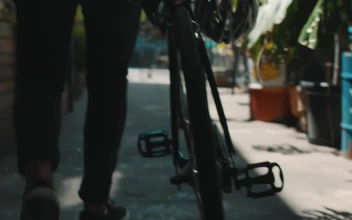 Stock Video An Urban Cyclist Walks With His Bike For PC