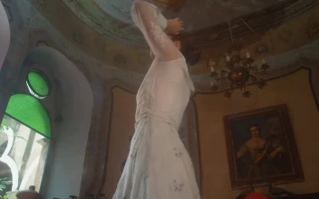 Stock Video An Old Fashioned Woman Spins In A White Dress For PC
