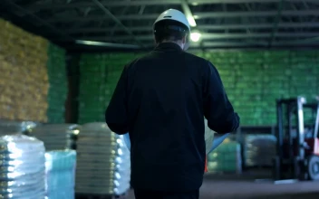 Stock Video An Engineer With Blueprint Walking On A Warehouse For PC