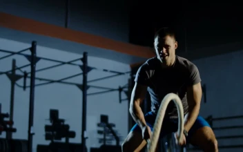 Stock Video An Athlete Using Thew Ropes In The Gym For PC