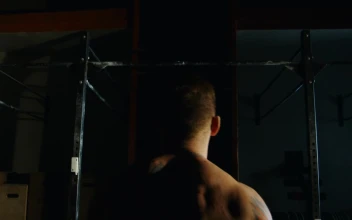 Stock Video An Athlete Doing Exercise In The Bars For PC