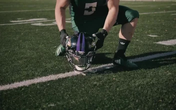 Stock Video Amateur Football Player Putting On His Helmet For PC