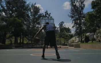 Stock Video Amateur Basketball Player Doing A Slam Dunk For PC