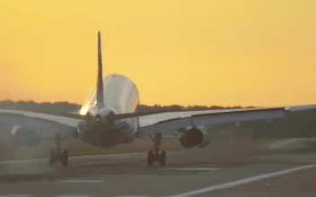 Stock Video Airplane Landing In Slow Motion In A Yellow Sky For PC