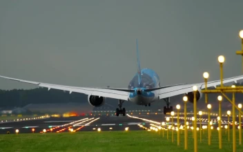 Stock Video Airplane Landing In Illuminated Airport Tracks For PC