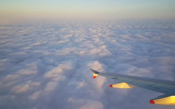 Stock Video Airplane Flying Above Beautiful Fluffy Clouds For PC