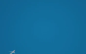 Stock Video Airplane Crossing The Clear Blue Sky For PC