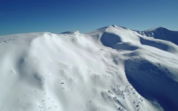 Stock Video Air Travel Over A Snow Covered Hill For PC