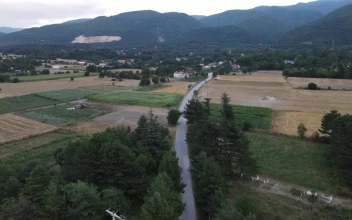 Stock Video Air Travel Above A Road Surrounded By Countryside For PC