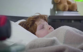 Stock Video Afraid Young Boy Pulls Bed Covers Over Head For PC