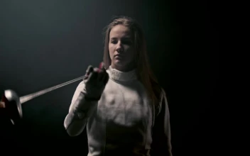 Stock Video A Young Woman Fencer Playing With Her Sword For PC