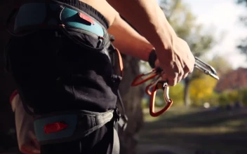 Stock Video A Young Man Preparing The Climbing Gear For PC