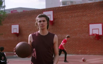 Stock Video A Young Man On The Basketball Court Bouncing The Ball For PC