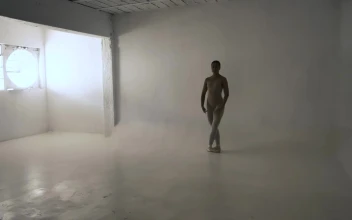 Stock Video A Young Ballerina Dancing In A White Room For PC