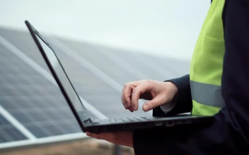 Stock Video A Worker With A Laptop Or On A Solar Panel For PC