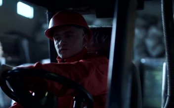 Stock Video A Worker Driving Through The Warehouse For PC