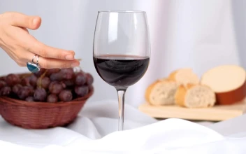 Stock Video A Womans Hand Takes A Glass Of Wine From An For PC