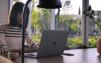 Stock Video A Woman Working On Her Laptop At An Office For PC