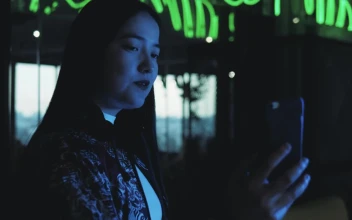 Stock Video A Woman Taking Selfies In The Street At Night For PC