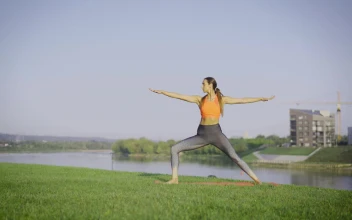 Stock Video A Woman Practicing Yoga Outdoors For PC