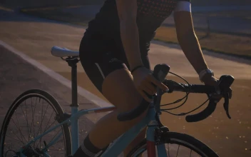Stock Video A Woman On A Bicycle Starts On A Cycling Track For PC