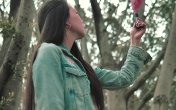 Stock Video A Woman Holding A Pink Smoke Bomb For PC