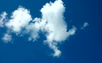 Stock Video A White Cloud Passing Through The Blue Sky For PC